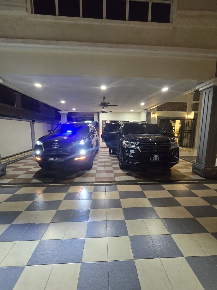 ZahraGO SUVs parked under a covered porch at night, Sabah