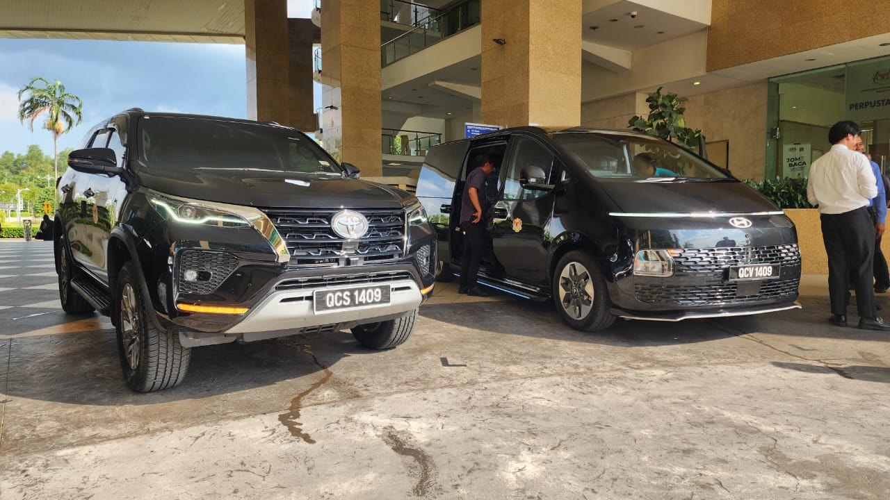 ZahraGO Toyota Fortuner and Hyundai Staria parked at a hotel entrance in Kota Kinabalu